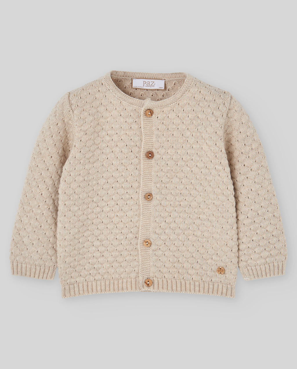 Chaqueta de punto avena LUMBRE para bebé, Paz Rodríguez, vista frontal.
