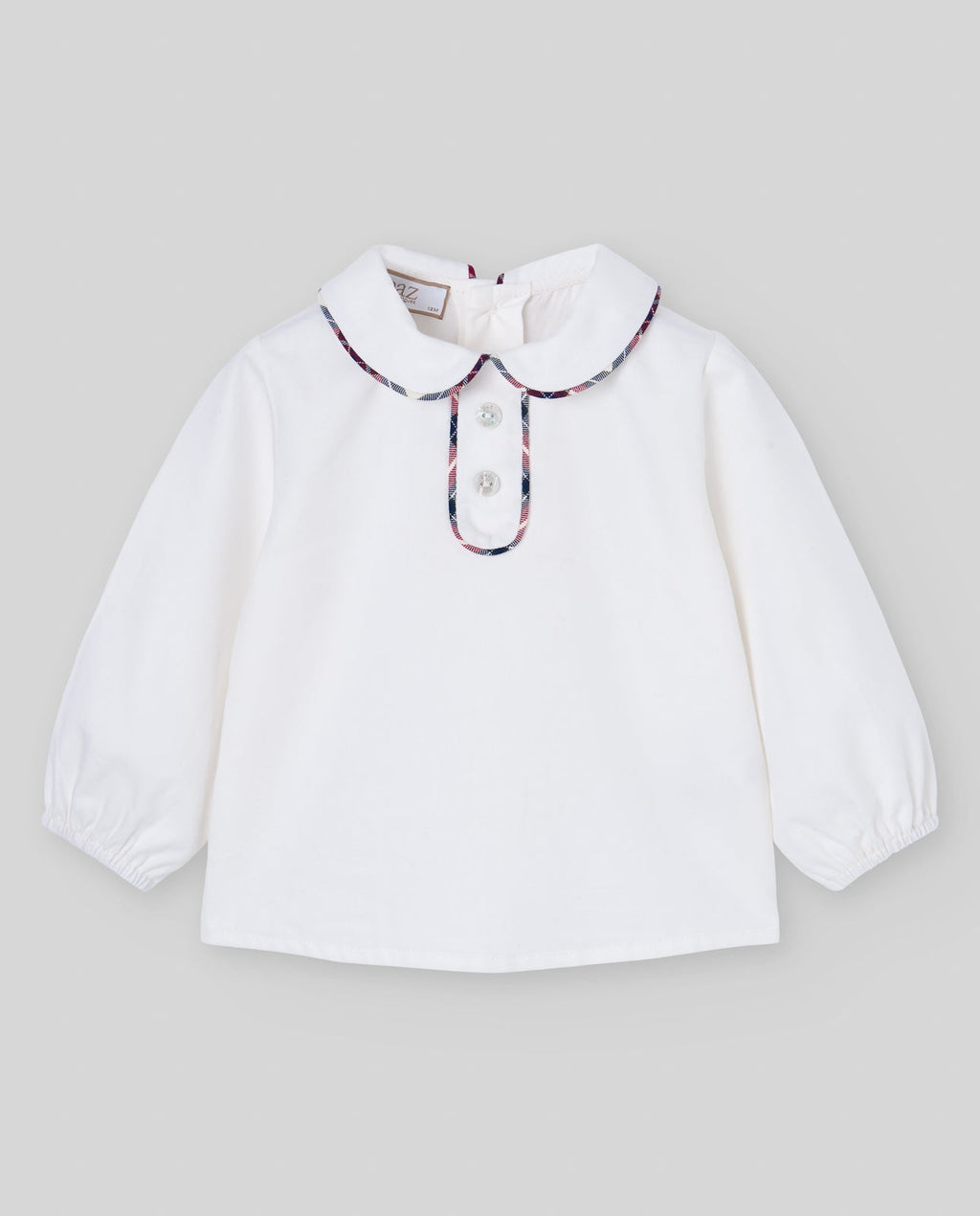 Blusa cruda del conjunto NADAL con ribete de cuadros, Paz Rodríguez, vista frontal.