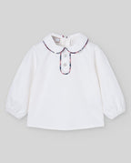 Blusa cruda del conjunto NADAL con ribete de cuadros, Paz Rodríguez, vista frontal.