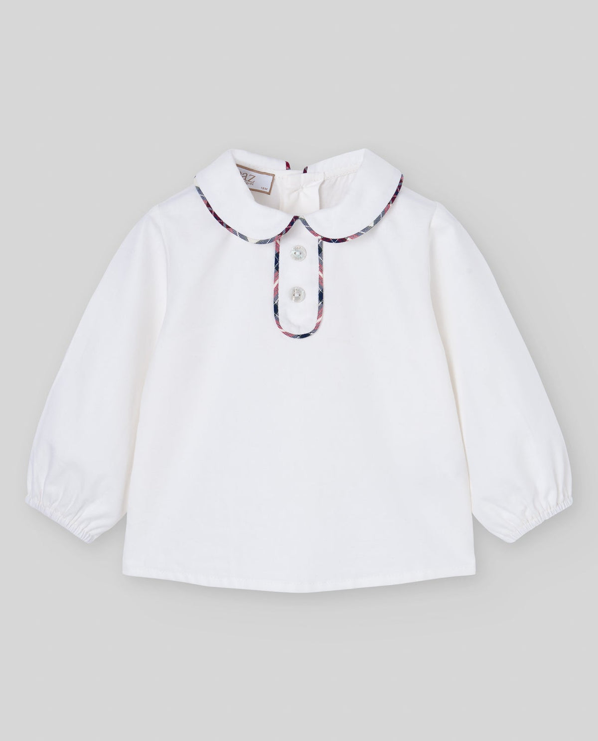 Blusa cruda del conjunto NADAL con ribete de cuadros, Paz Rodríguez, vista frontal.