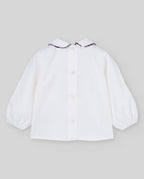 Blusa cruda del conjunto NADAL con ribete de cuadros, Paz Rodríguez, vista posterior.