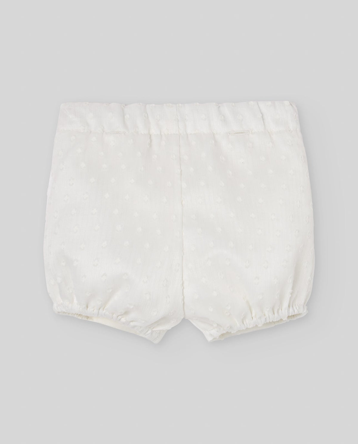 Pantalón corto del conjunto exclusivo PAZ para bebé.